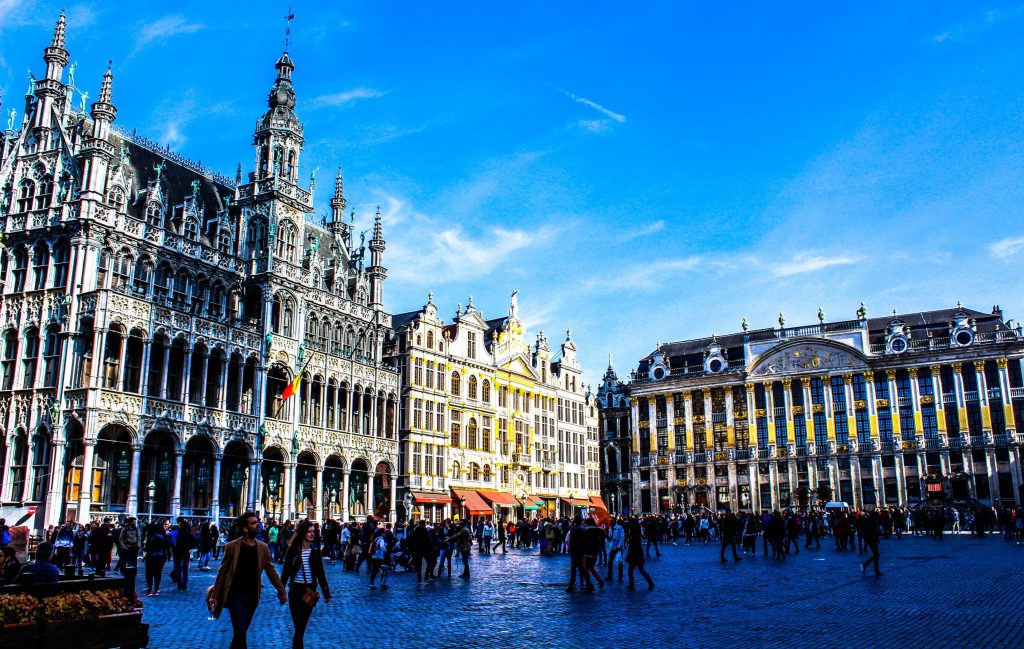 Large square in Brussels, people walking around.