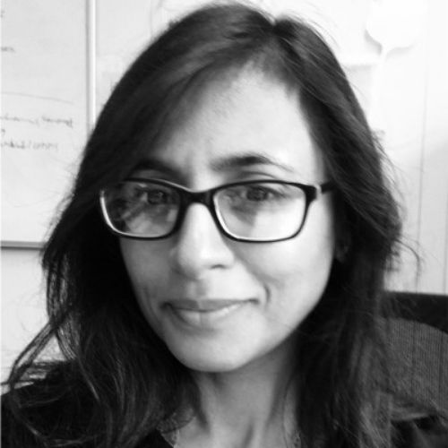 Hemini Mehta is smiling at the camera.