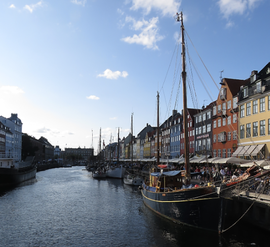 A ferry is navigating one of Copenhagen channel